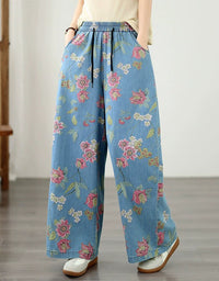 Boho inspired floral denim trousers with pink botanical print