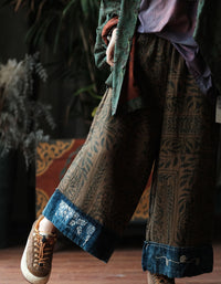 Front view of women’s boho ethnic print wide leg pants with elastic waist and wide cuffed hem