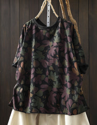 Black oversized cotton top with green and yellow floral print, front view