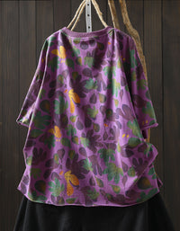 Women wearing purple floral oversized cotton top with black pants