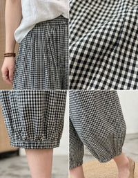 Details of women black plaid pants elastic waist casual style