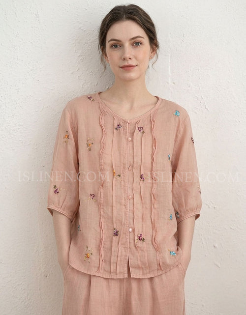 Women’s blush pink embroidered linen blouse with floral details and button front