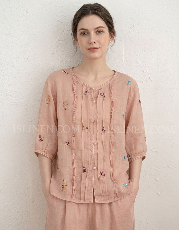 Women’s blush pink embroidered linen blouse with floral details and button front