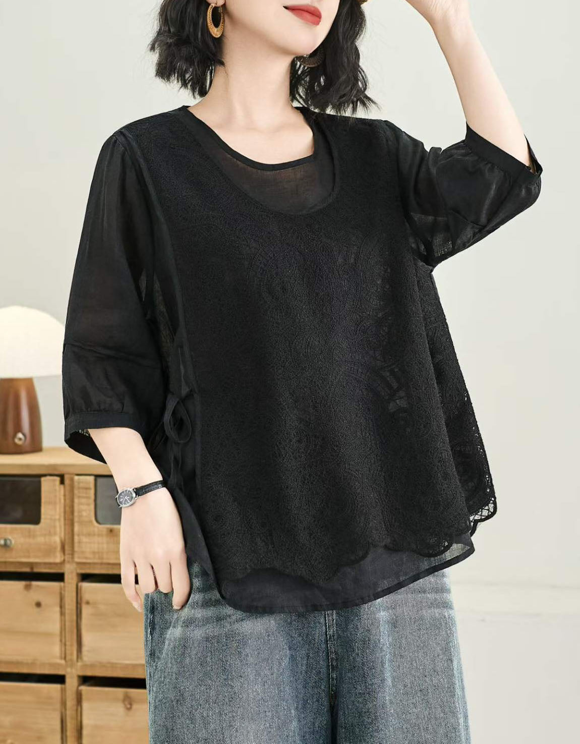 Women's boho white lace top featuring floral embroidery and relaxed fit