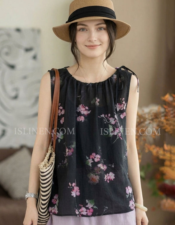 Front view of black floral print sleeveless summer top