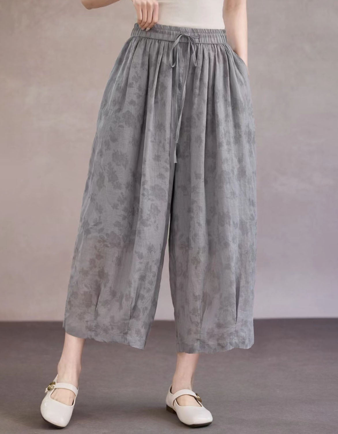 Women lightweight floral palazzo pants paired with flats