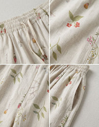 Woman wearing white floral linen wide leg pants for a casual boho summer outfit