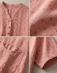Close-up of cotton linen blouse fabric showing subtle floral pattern and button placket detail