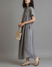 Minimalist oversized dress styled with sandals and handbag