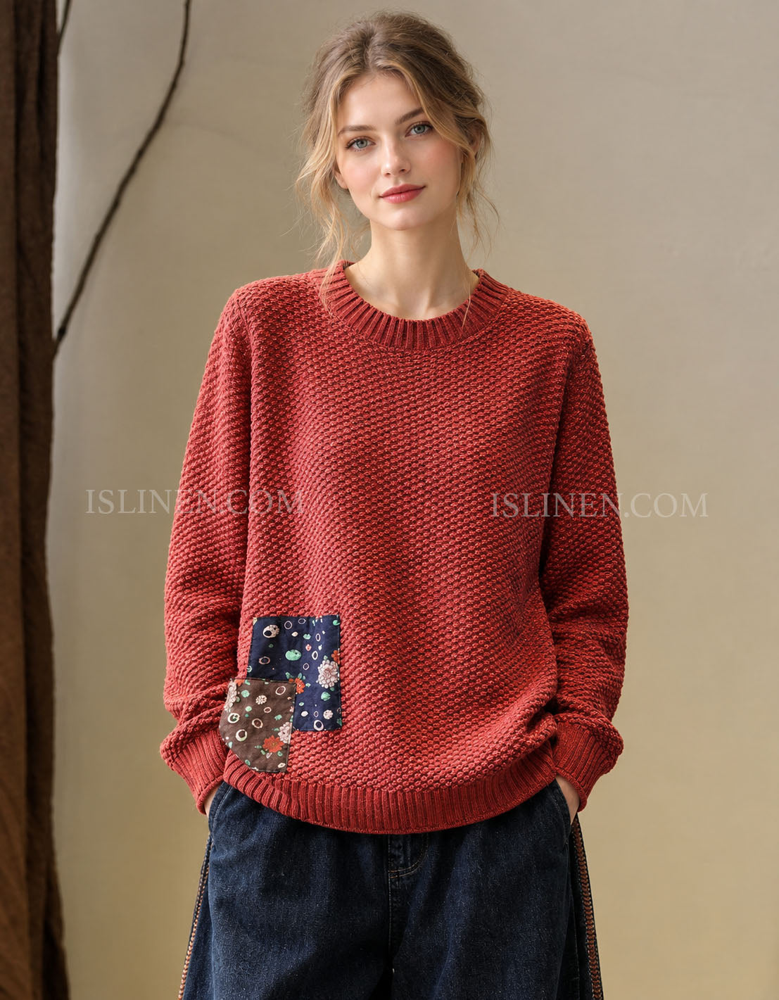 Women’s red textured knit sweater with patchwork detail, front view