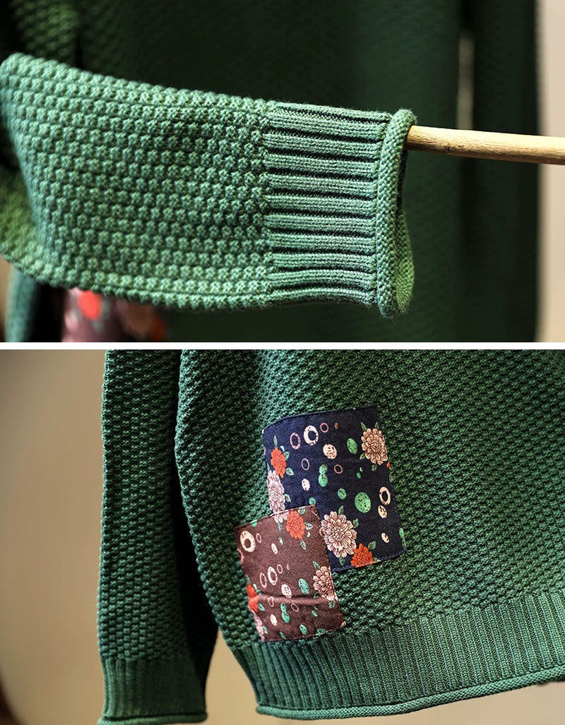 Close-up of textured knit fabric and patchwork detail on red women’s sweater