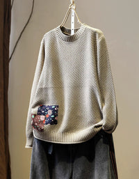Women’s camel textured knit sweater with patchwork detail, front view