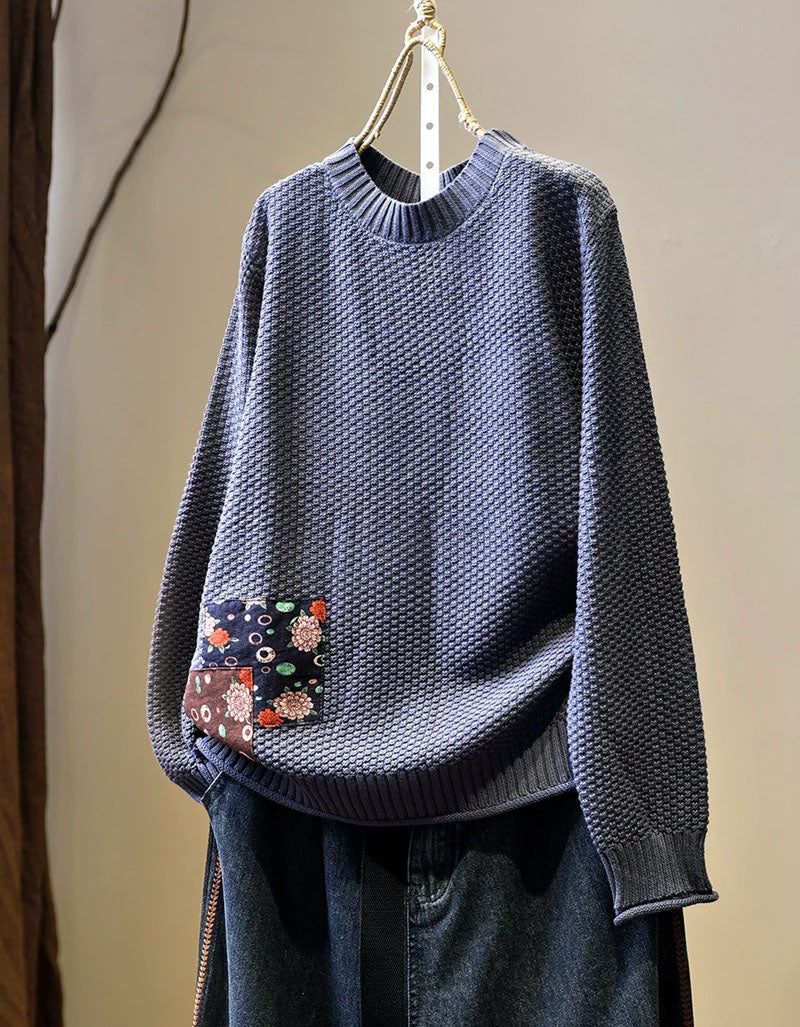 Women’s light purple long sleeve knit pullover styled with dark denim jeans