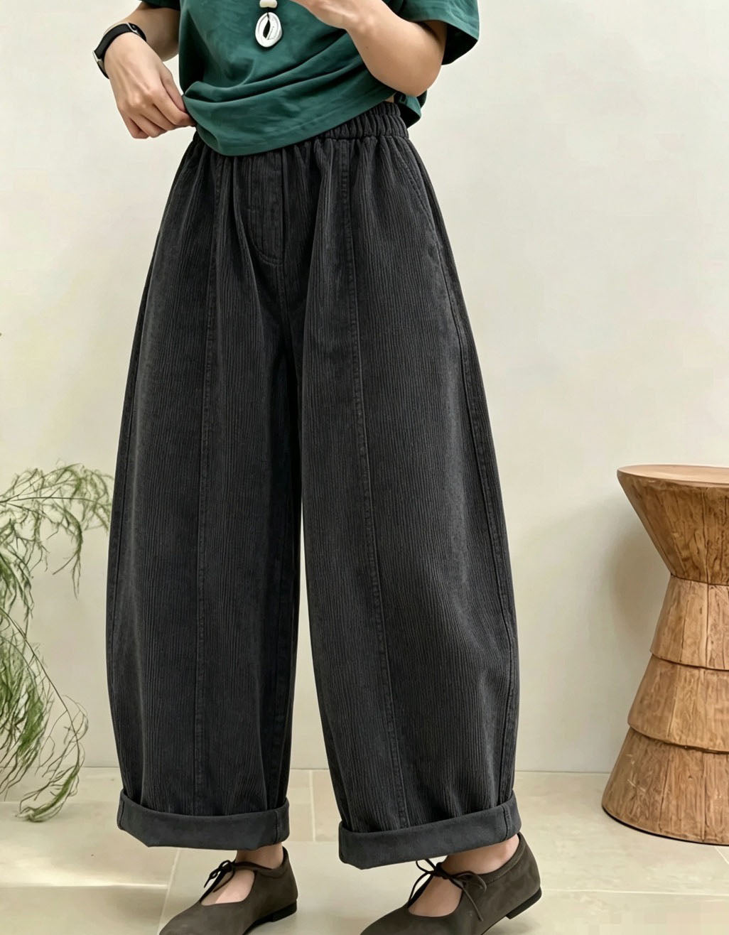 Women's casual wide leg pants styled with sweater and flats