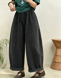 Women's casual wide leg pants styled with sweater and flats