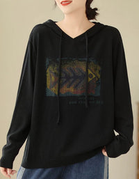Women’s black sweater with vintage graphic print