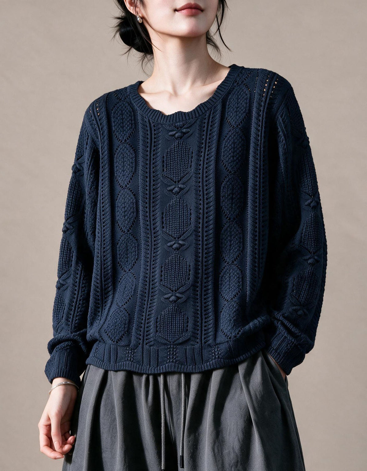 Purple women's sweater with detailed cable knit sleeves