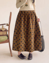 Full view of women's brown polka dot corduroy skirt