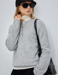 Women’s gray long sleeve pullover sweater styled