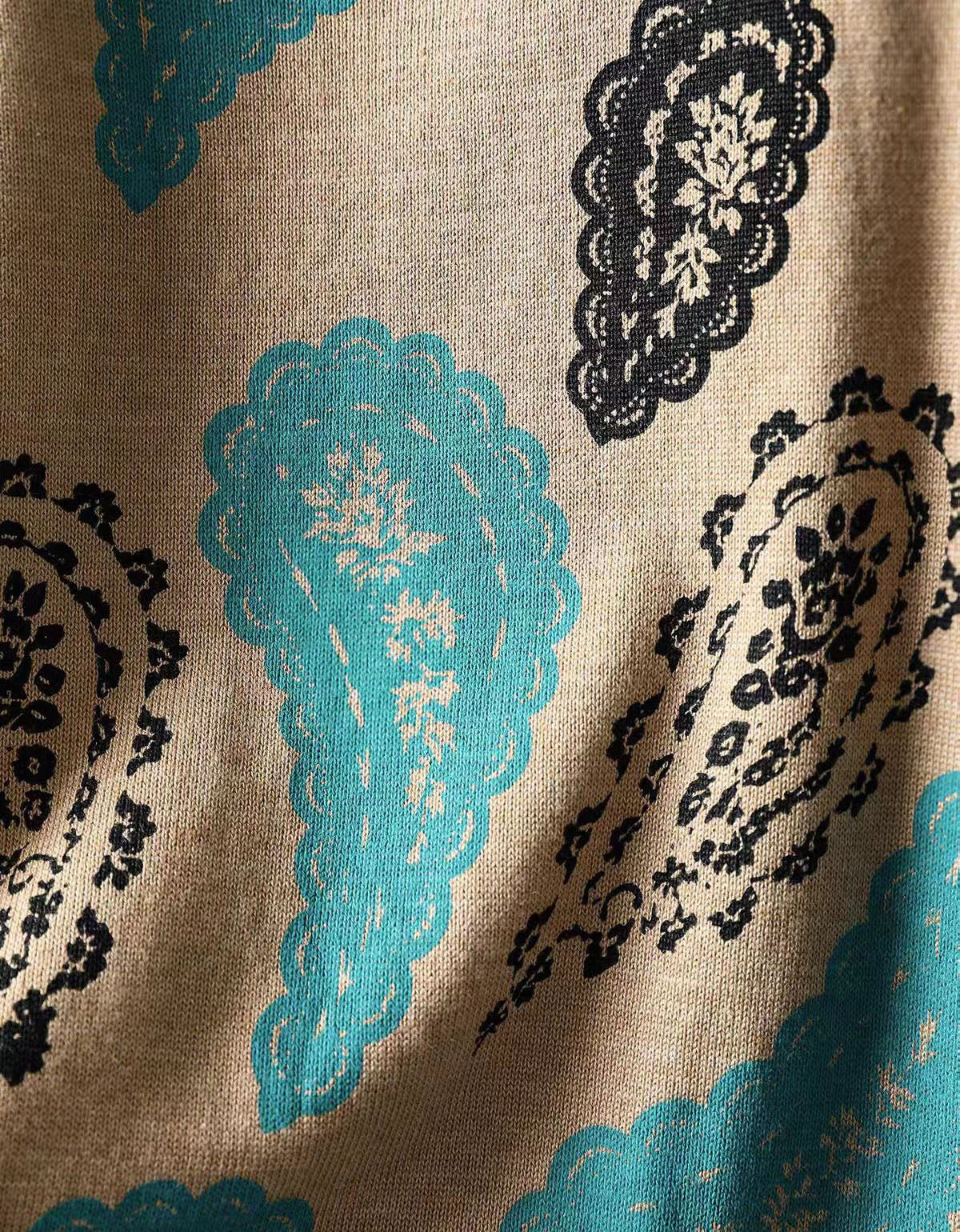A close-up of long sleeve paisley knit dress for women