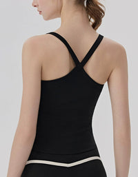 Black tank top worn by a person on a plain background