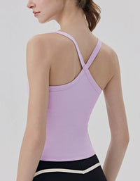 Person wearing a light purple tank top with thin straps on a plain background back view
