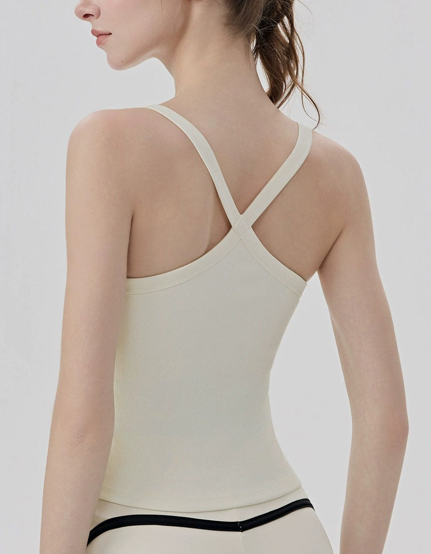 Beige tank top with thin straps on a plain background back view