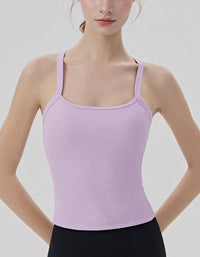 Person wearing a light purple tank top against a plain background