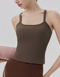 Brown ribbed tank top worn by a person on a plain background