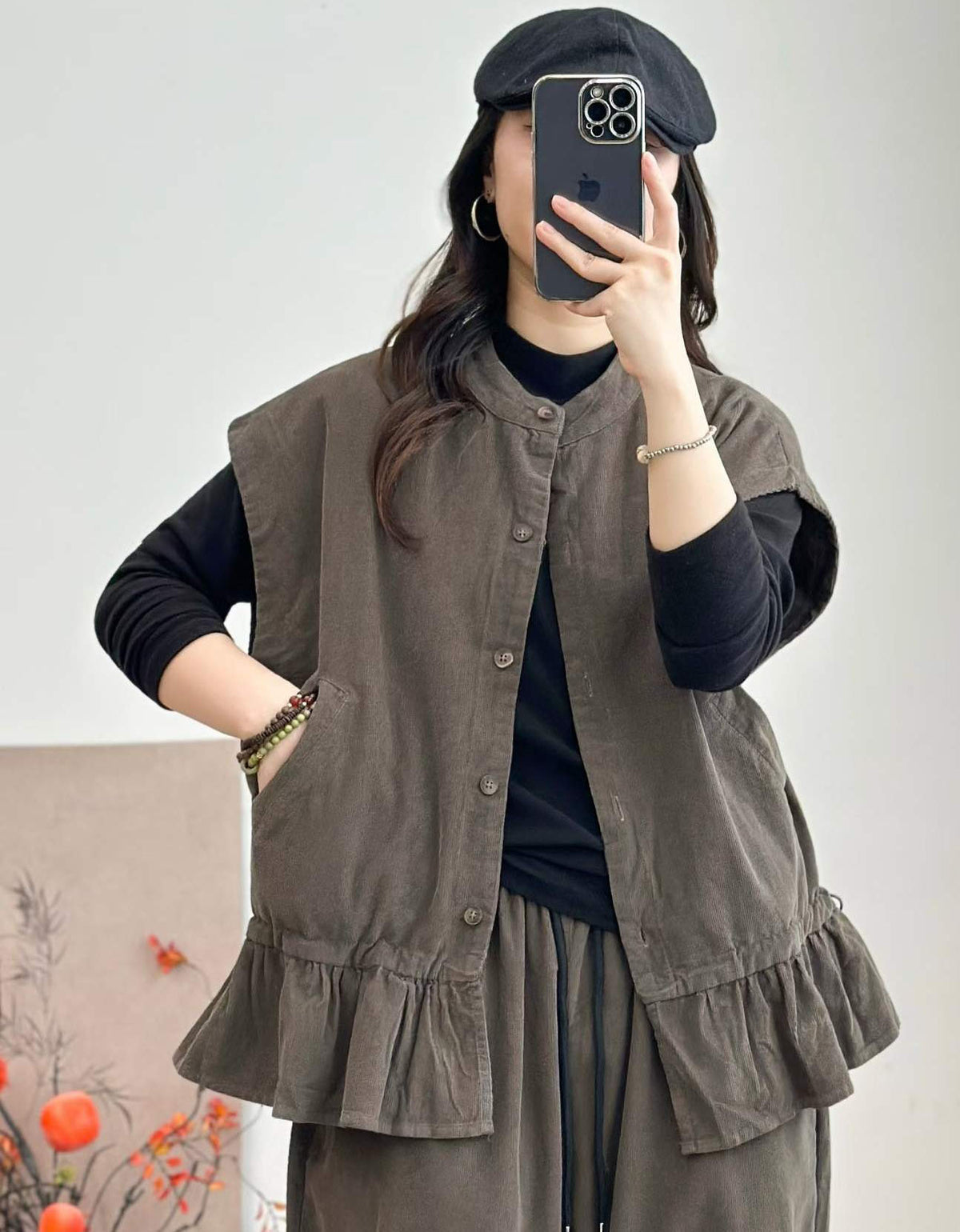 Gray women's sleeveless vest with side pockets