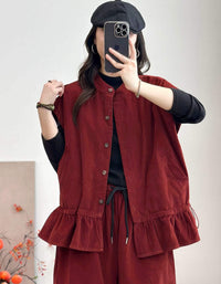 Red sleeveless utility vest styled with black top