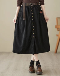 Alt text:
Women’s black corduroy skirt with belt detail, button front closure, and high-waisted design for a stylish and comfortable fit