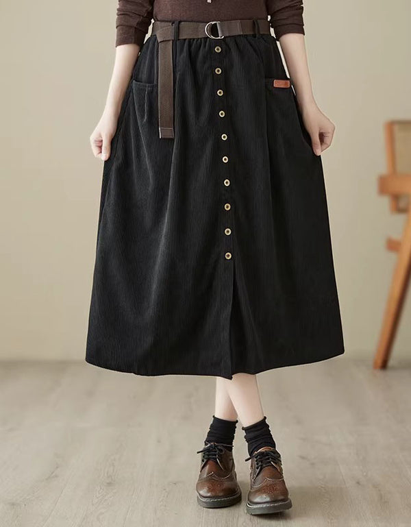 Alt text:
Women’s black corduroy skirt with belt detail, button front closure, and high-waisted design for a stylish and comfortable fit