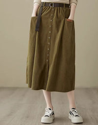 Women’s olive green corduroy skirt with button front closure and belt detail, high-waisted midi skirt for casual styling
