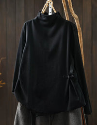 Black women's high neck sweater with asymmetrical hem and side button detail