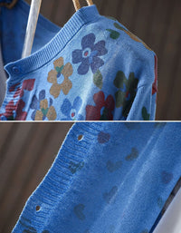 Close up of blue floral knit cardigan texture and button details