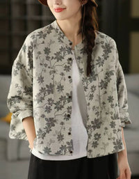 Women wearing vintage floral linen jacket with button-up design