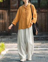 Women wearing breathable yellow linen hoodie top outdoor style