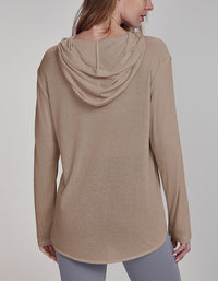 Beige hooded long-sleeve top worn by a person on a plain background back view