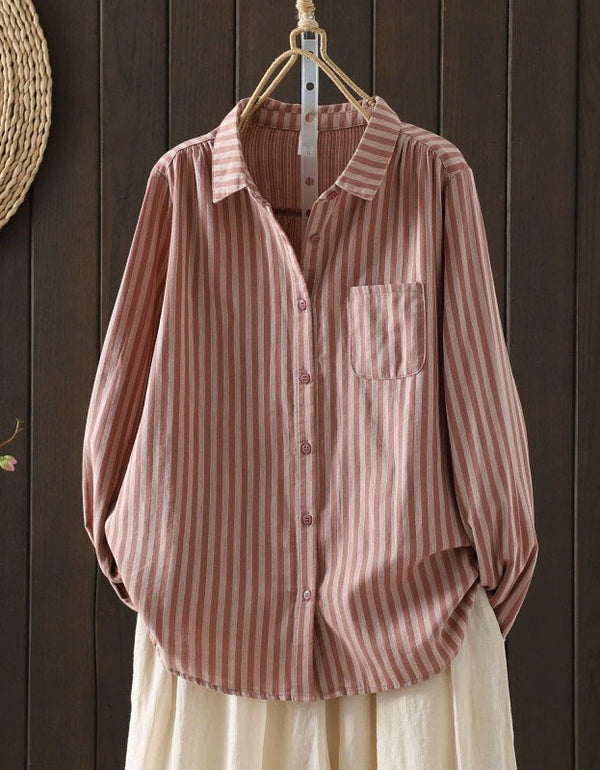 Front view of women’s long sleeve striped shirt with button closure pink