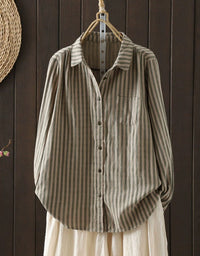 Front view of women’s long sleeve striped shirt with button closure green