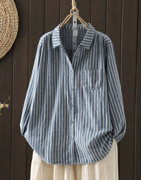 Front view of women’s long sleeve striped shirt with button closure blue
