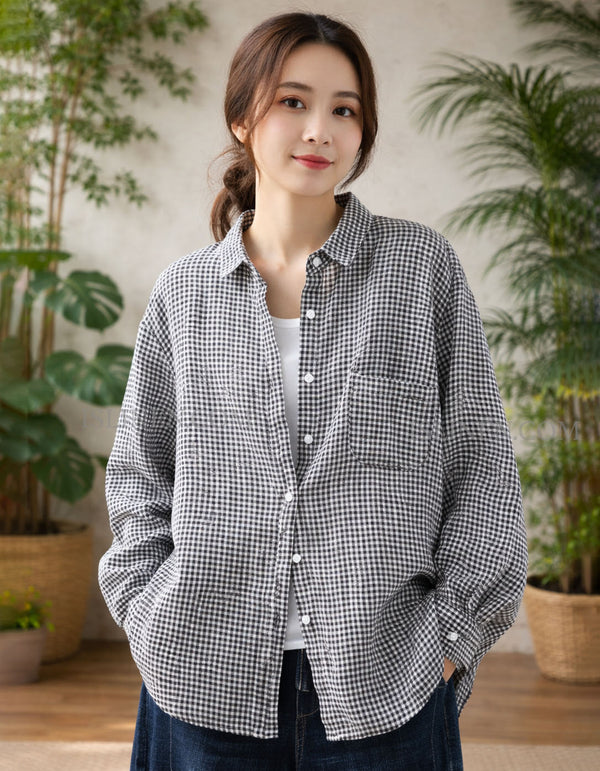 Woman wearing a checkered shirt in a room with plants