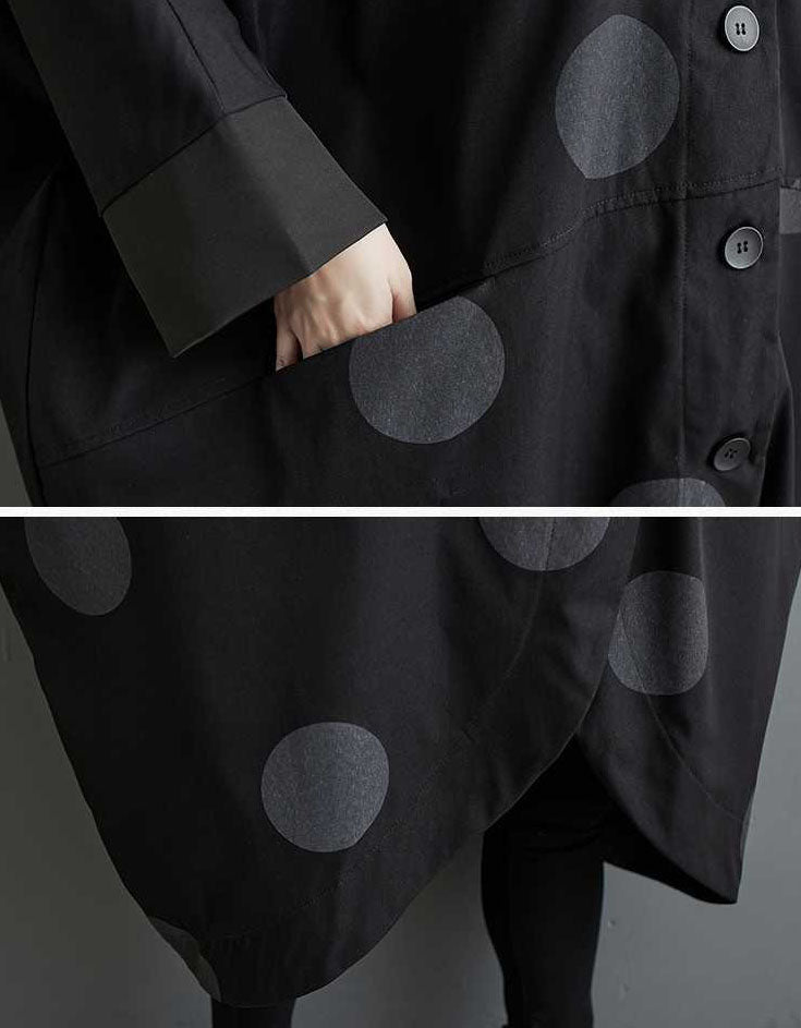 Casual women’s long polka dot coat styled with black boots and leggings
