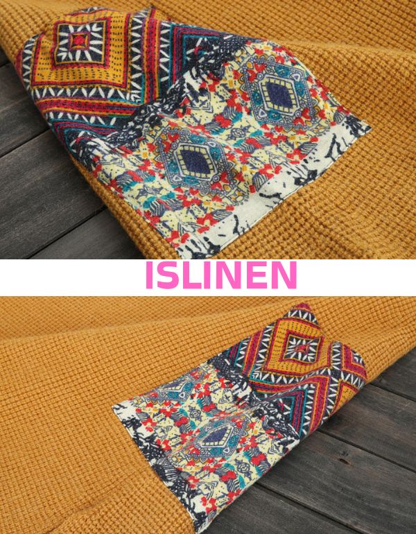 Close-up of patch pocket detail on women’s knitted sweater vest