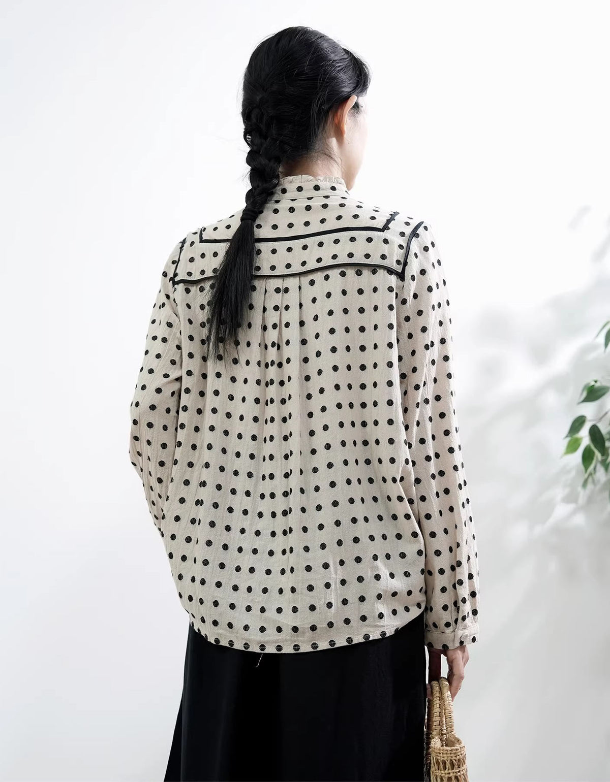 Stylish women blouse with black and white polka dot pattern