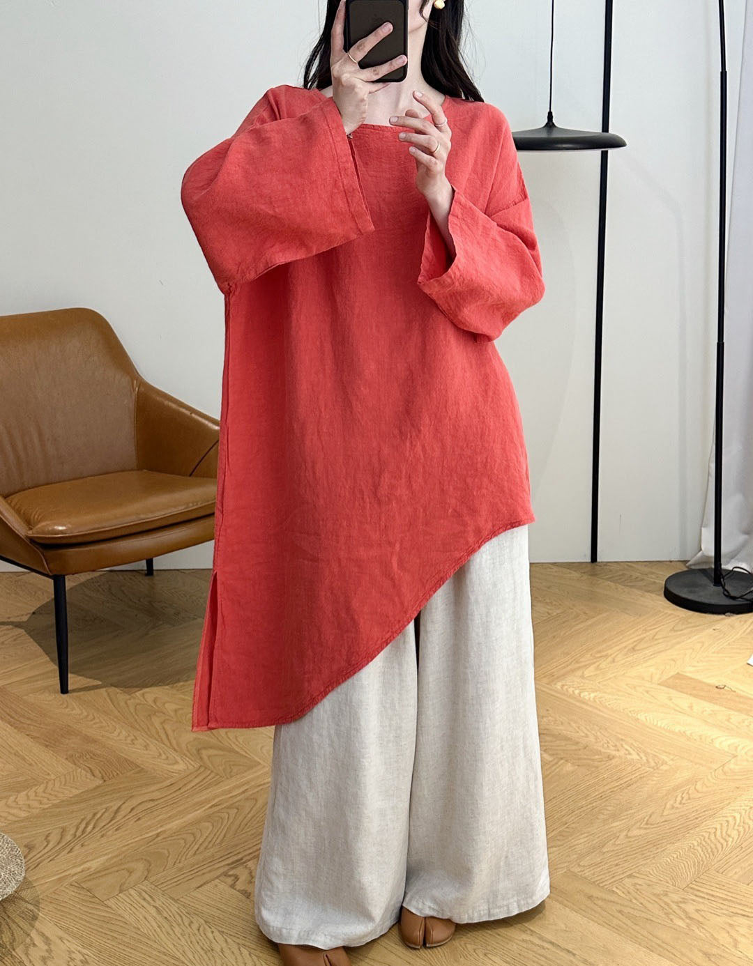 Full view of women's asymmetrical loose fit linen tunic blouse