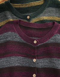 Women's green striped cardigan styled with casual outfit