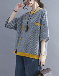 Striped top paired with casual denim pants