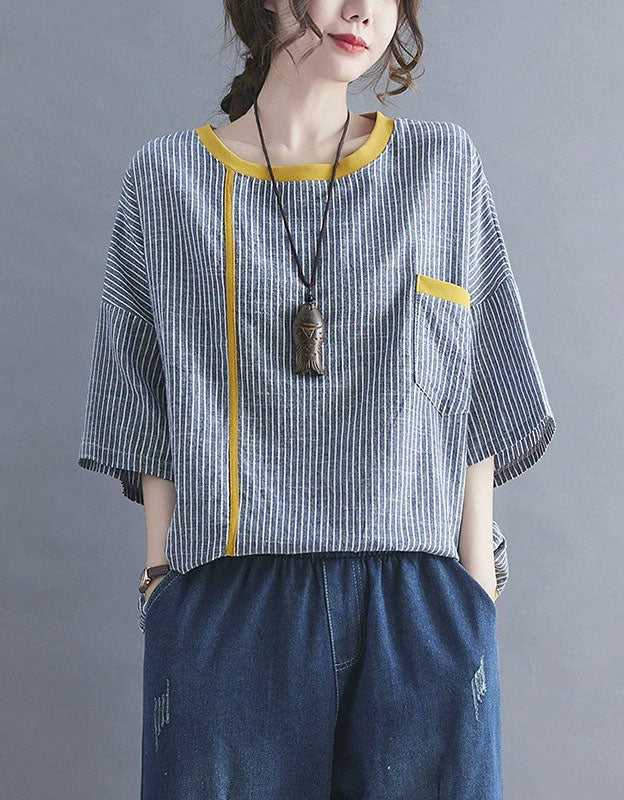 Women wearing striped loose fit top with contrast trim